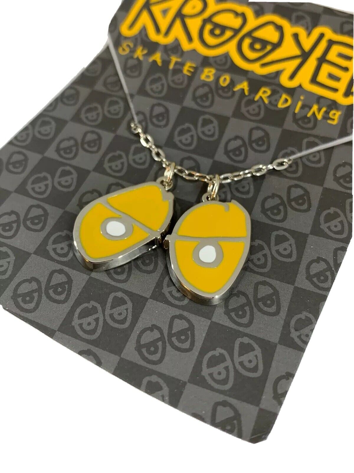 Krooked Eyes Skateboard Pendant mens unisex Necklace Silver/Yellow NWT